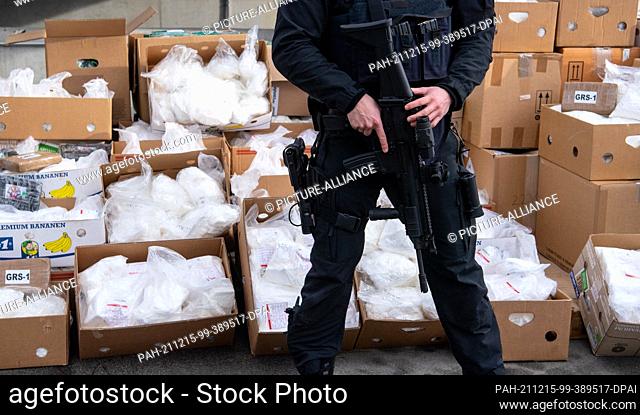 14 December 2021, Bavaria, ---: Police officers guard cocaine before it is transported to a waste incineration plant. As part of Operation Snowmelt