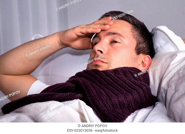 Man Suffering From Cold And Fever