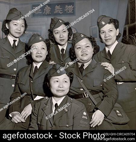 Group Portrait of a unit of Chinese American Women who served in the American Women's Voluntary Services, Back row, Mrs. Florence Wong, Mrs