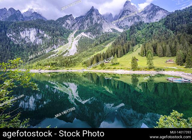 dachstein mountains reflected in gosau beautiful lake, austria