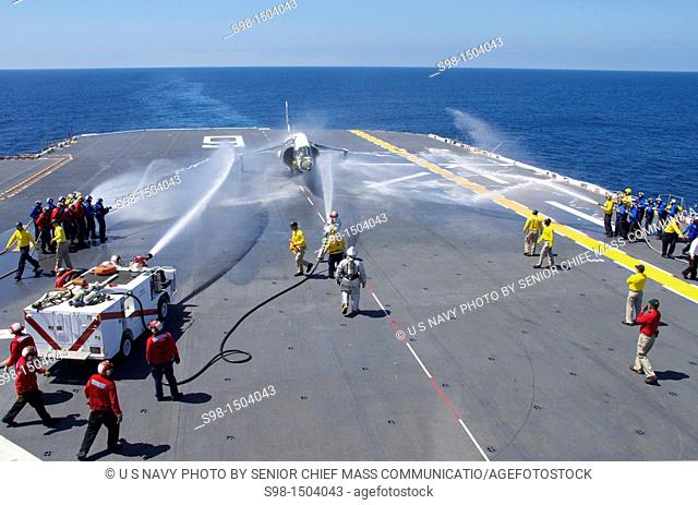 PACIFIC OCEAN July 12, 2011 Sailors aboard the amphibious assault ship USS Bonhomme Richard LHD 6 conduct a flight deck fire drill