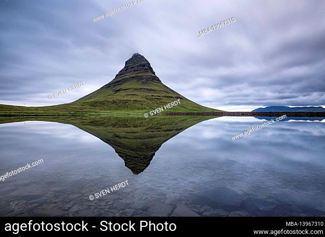 Kirkjufell on the Snaefellsnes peninsula in Iceland is reflected in a lake