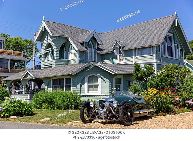 Martha's Vineyard colored painted wood houses vintage sport car cycle car Oak Bluffs MA USA Massachussets