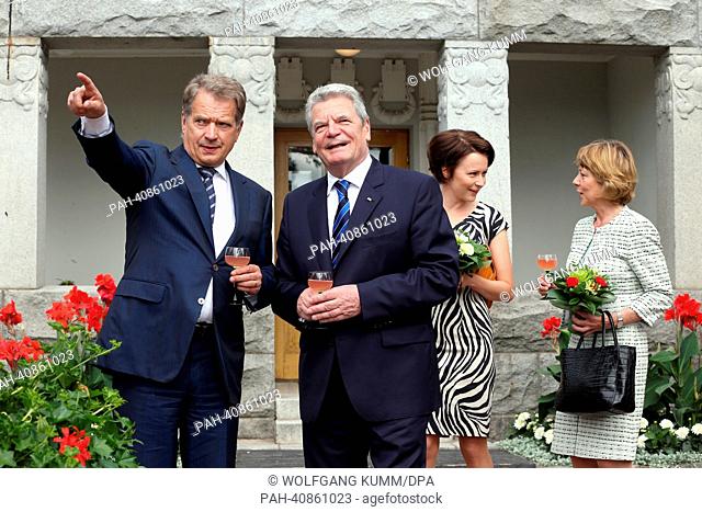 German President Joachim Gauck and his partner Daniela Schadt (R) are welcomed by Finish President Sauli Niinisto (L) and his wife Jenni Haukio in the summer...
