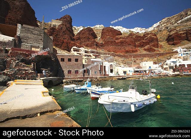 View to the traditional fishing boats and traditional Cycladic buildings in Ammouidi bay below Oia village, Santorini Island, Cyclades Islands, Greek Islands