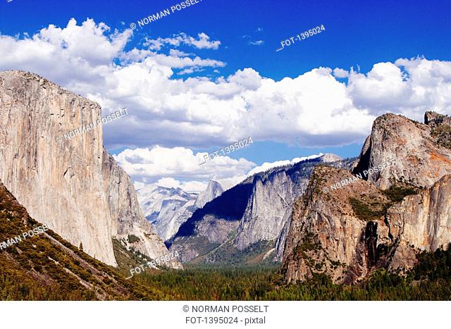 Rock formations at Yosemite National Park against cloudy sky