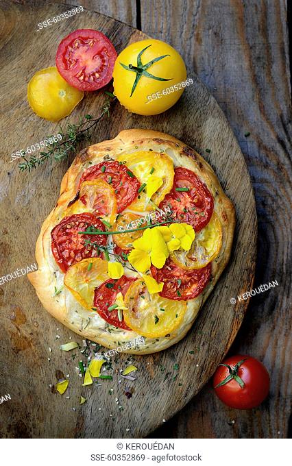 Red and yellow tomato pizza