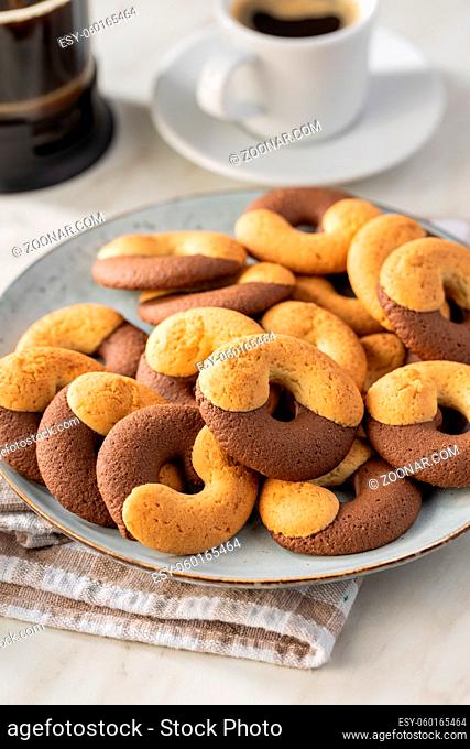 Sweet round biscuits. Cookies with double flavor on kitchen table