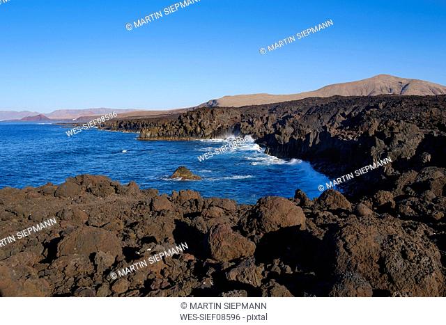 Spain, Canary Islands, Lanzarote, Tinajo, Los Volcanos nature park, view over rocky coast