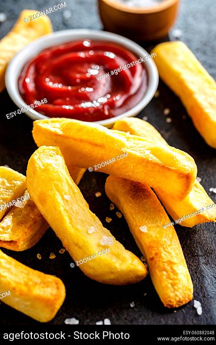 Big french fries. Fried potato chips with ketcheup