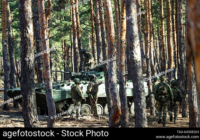 RUSSIA, LUGANSK PEOPLE'S REPUBLIC - NOVEMBER 1, 2023: Servicemen of the Ulyanovsk volunteer battalion of the Central Military District on a BMP-2 amphibious...