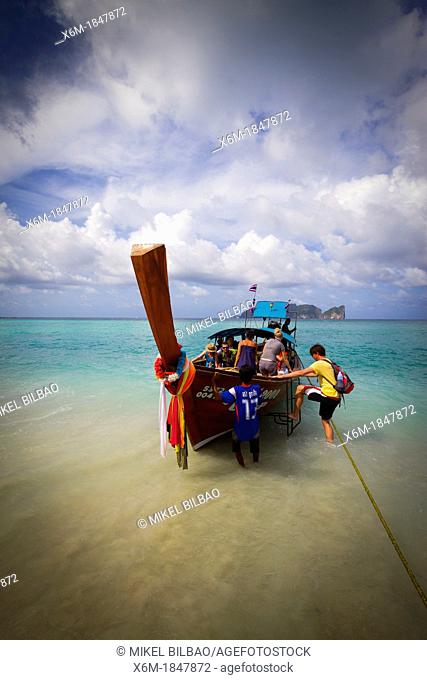 Longtail boat and tourists on Long beach  Phi Phi Don island  Krabi province, Andaman Sea, Thailand