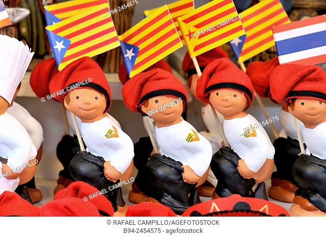 'Caganers', Catalonia independent flags, particular feature of modern nativity scenes at Santa Llucia Christmas fair, Barcelona. Catalonia, Spain