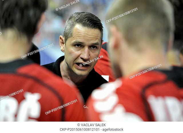 Czech Republic coach Jan Filip talks to his players during qualifying handball match Czech Republic vs France for 2016 Men's European Championship in Brno