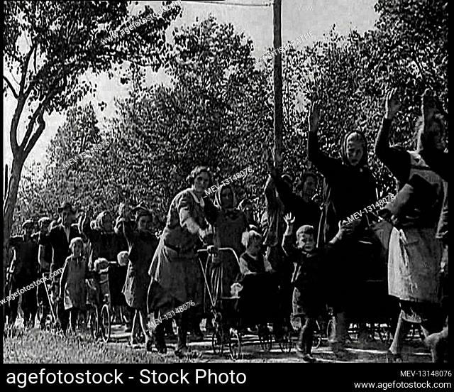 Sudeten Germans Walking Along a Path Lined With Tree As If Refugees Away From Czechoslovakia, Some Making The Nazi German Salute - Czechoslovakia