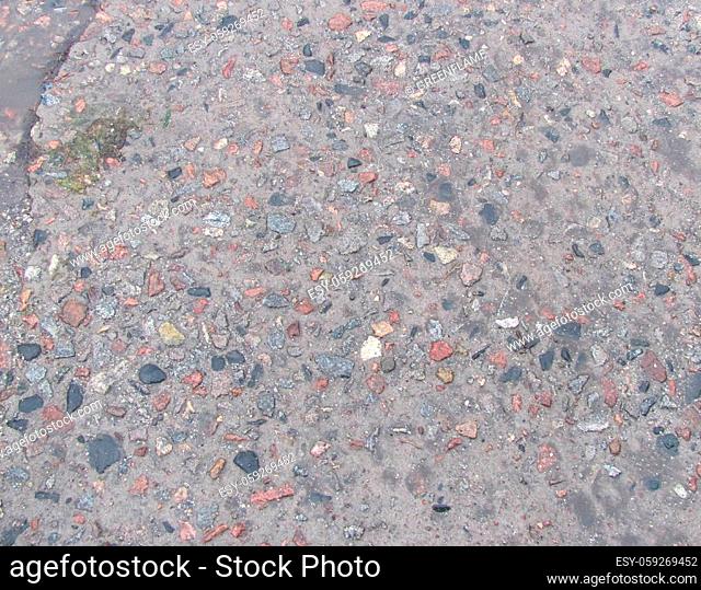 wet concrete texture background with small stones in it