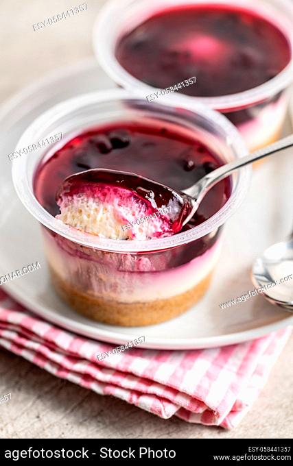 Sweet desssert. Cheesecake cup on plate