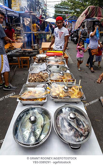 A Display Of Restaurant Food Dishes In The Street During The Dinagyang Festival, Iloilo City, Panay Island, The Philippines