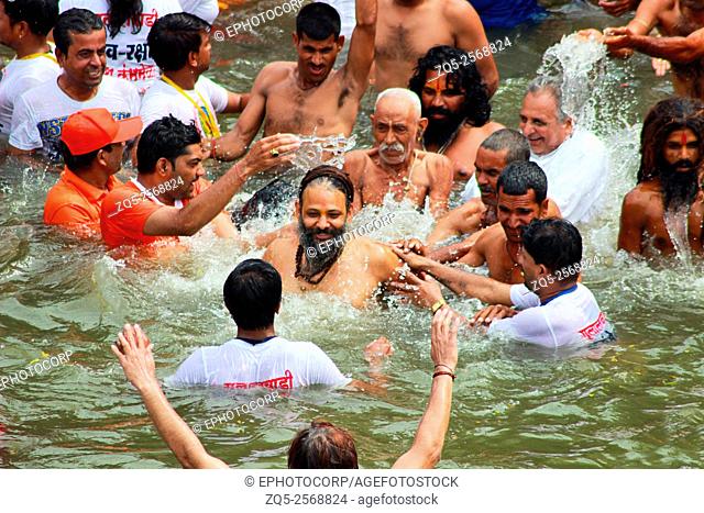 Shahi Snan. Holy men and devotees taking royal bath in holy river. Kumbh Mela, Nasik, Maharashtra, India