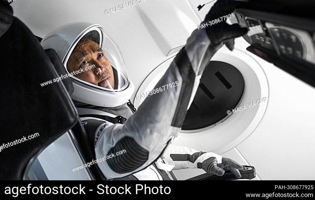 JAXA astronaut Koichi Wakata wears a SpaceX launch and entry suit while becoming familiar with the Crew Dragon spacecraft that will take Wakata and his...