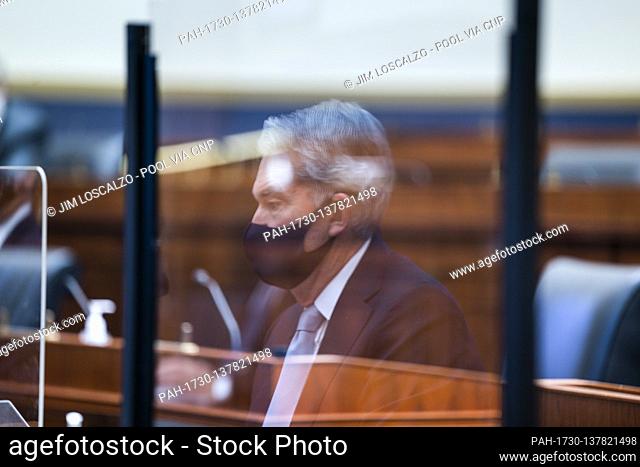 Jerome H. Powell, Chair of the Board of Governors of the Federal Reserve System is seen in a reflection as he testifies before a House Financial Services...