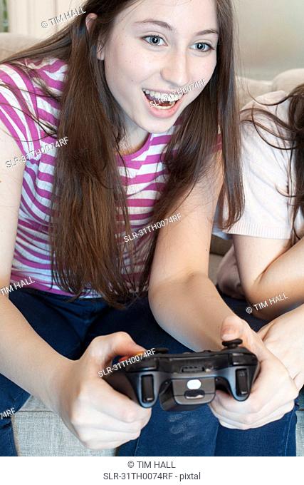 teenage girl playing a video game