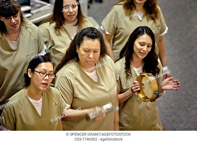 A choir of female inmates at the Santa Ana, CA city jail sings at graduation of a jail educational program