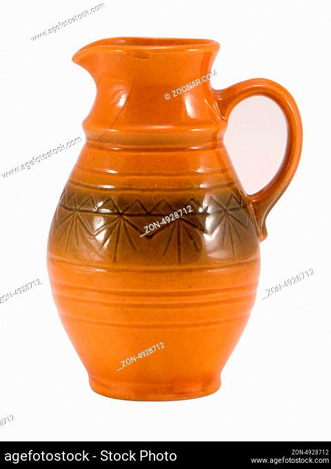 vintage old clay pitcher brown color object with handle and ornaments isolated on white background