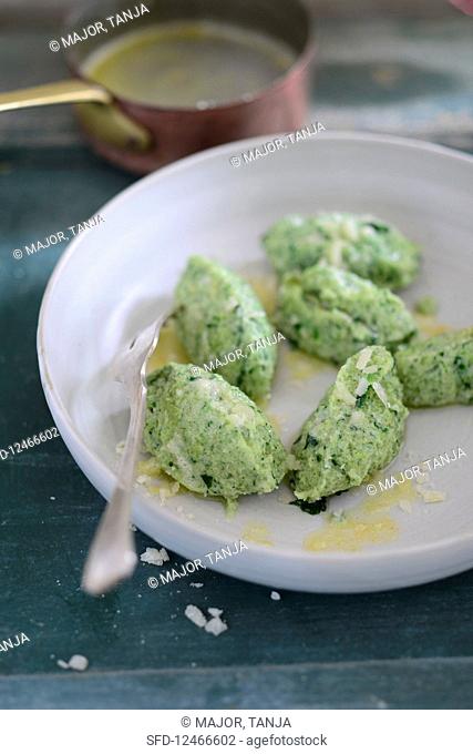 Spinach dumplings with melted butter