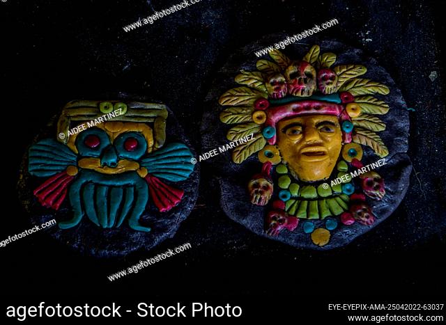 OZUMA, MEXICO - APR 25, 2022: Diego Barranco Flores during the manufacturing of handmade cookies with pre-Hispanic themes