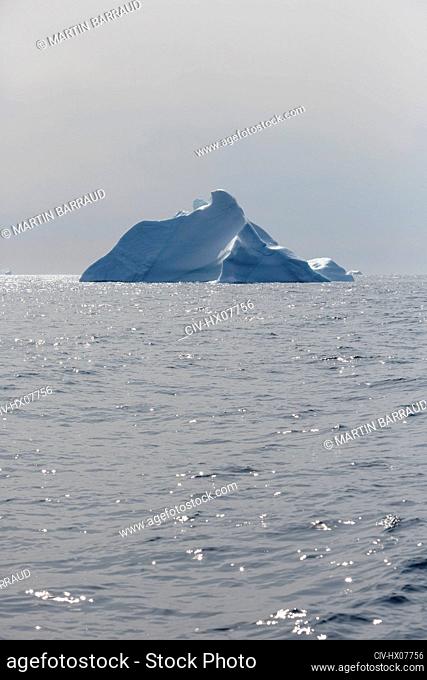 Iceberg over sunny Atlantic Ocean Greenland