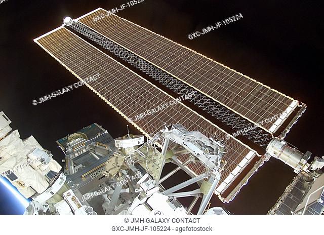 Backdropped by the blackness of space, this view of the starboard solar array wing panel of the International Space Station (ISS) was photographed with a...
