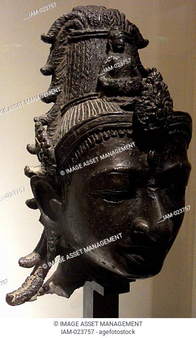 Head of Avalokitesvara around the 8th century in the style of My Son E1 Bronze. Vietnamese. Avalokitesvara 'Lord who looks down' is a bodhisattva who embodies...