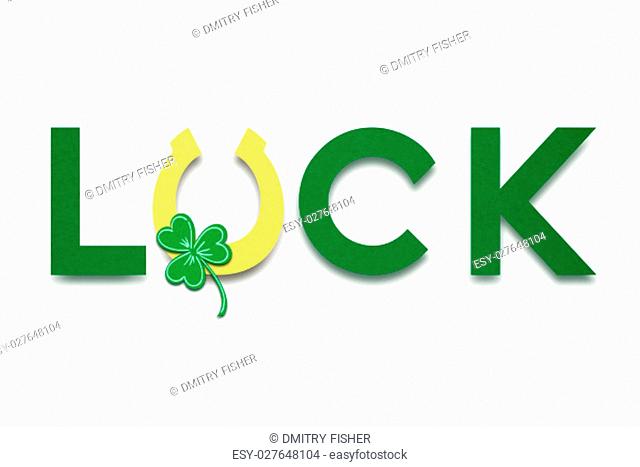 Creative St. Patricks Day concept photo of a luck sign made of paper on white background