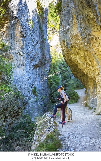 Woman hiker in a gorge. Desfiladero del Rio Puron route. Valderejo Natural Park, Alava, Spain, Europe