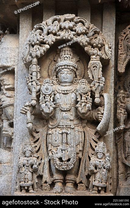 Carved Lord Vishnu idol on the outer wall of the Chennakesava Temple, Somanathapura, Karnataka, India