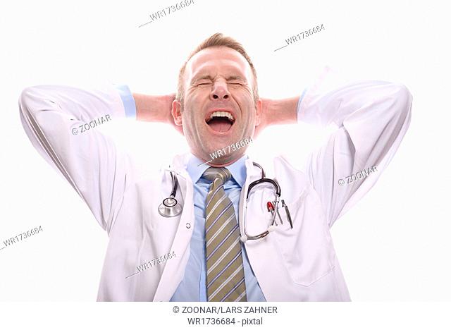 Satisfied successful doctor relaxing and yawning