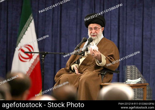 HANDOUT - 14 December 2023, Iran, Tabriz: Iranian Supreme Leader Ayatoallah Ali Khamenei meets with the members of the Congress of Commemoration of 10
