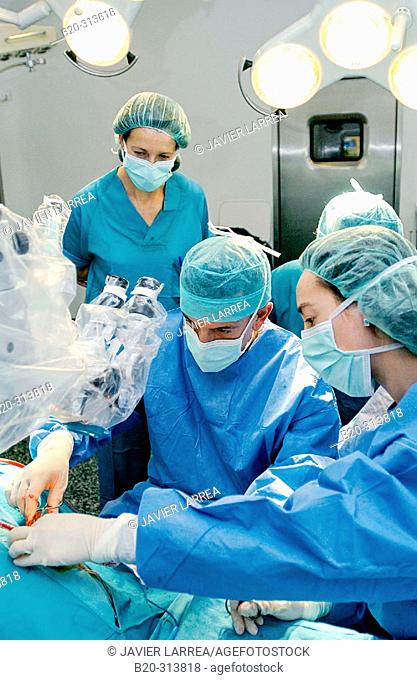 Surgeons during hearing operation at otorhinolaryngology operating room of hospital