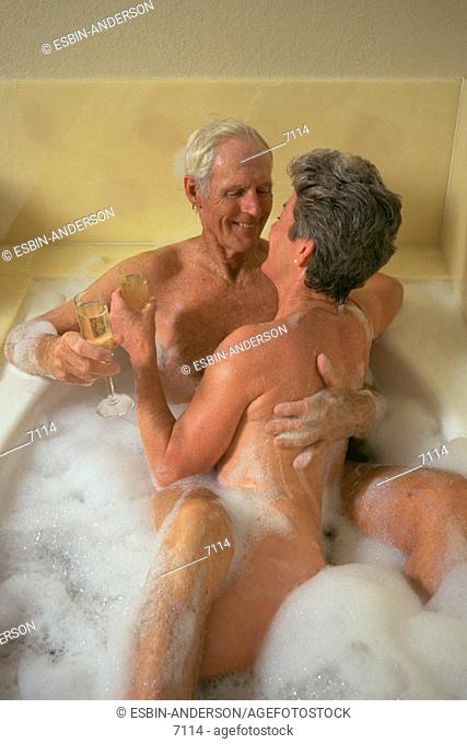 Senior couple taking bubble bath