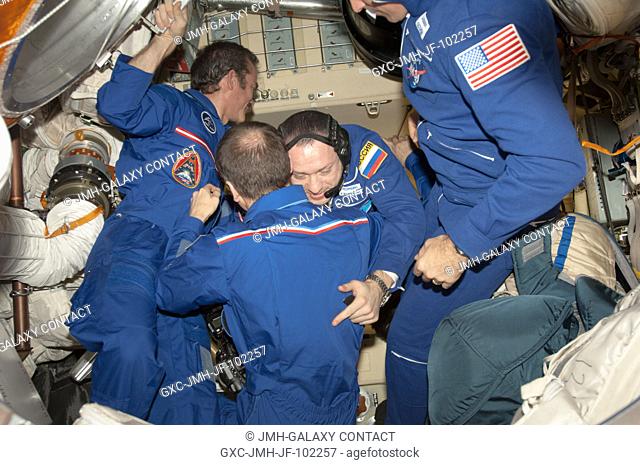 In this scene in the Poisk or Mini-Research Module 2 (MRM2), the two crew components for Expedition 35 begin to reunite in Earth orbit soon after the Soyuz...