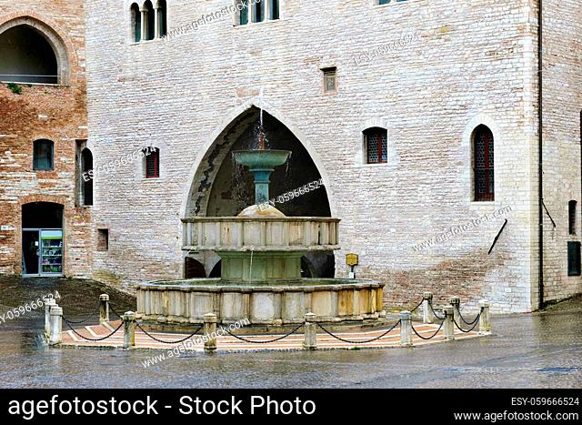Typical architecture with fountain of village Fabriano in Italy, Marche