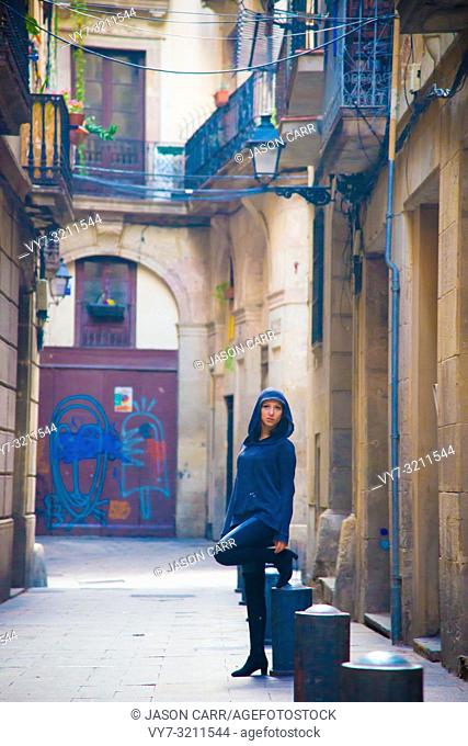 Caucasian female model poses for pictures at the tourists destination Barcelona, Spain. Barcelona is known as an Artistic city located in the east coast of...