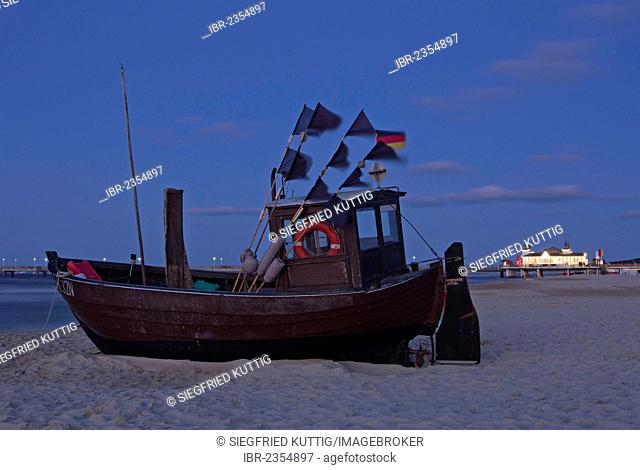Fishing boat on a beach in the evening, pier, Ahlbeck, Usedom Island, Mecklenburg-Western Pomerania, Germany, Europe