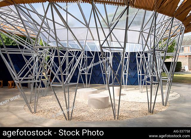 The 2017 Serpentine Pavilion, a temporary structure made of wood, in dark blue and natural colours, organic shapes with central courtyard