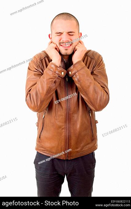 portrait of handsome young man covering his ears, isolated white background