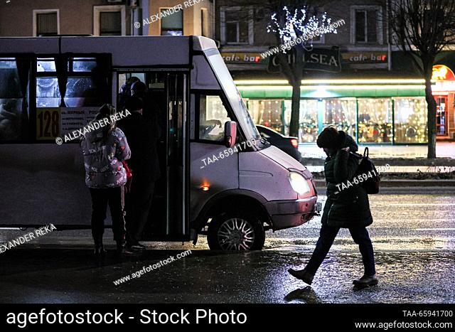 RUSSIA, LUGANSK - DECEMBER 20, 2023: A shuttle bus picks up passengers on Sovetskaya Street. Alexander Reka/TASS