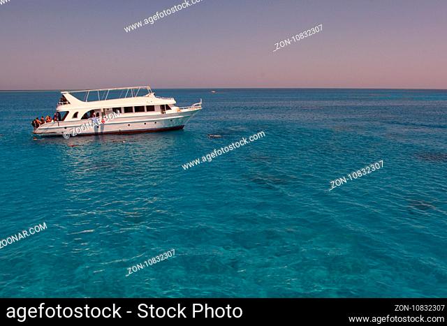 Tourists boat anchored in a bay in the red sea for snorkeling, luxury yacht