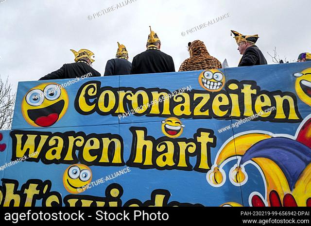 19 February 2023, Bavaria, Coburg: ""Corona times were hard now it's uphill again"" is written on a carnival float. Carnival parade through Coburg