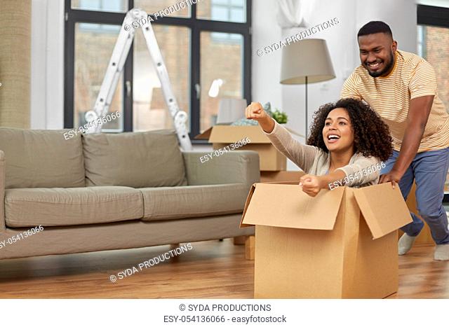 happy couple moving to new home and having fun